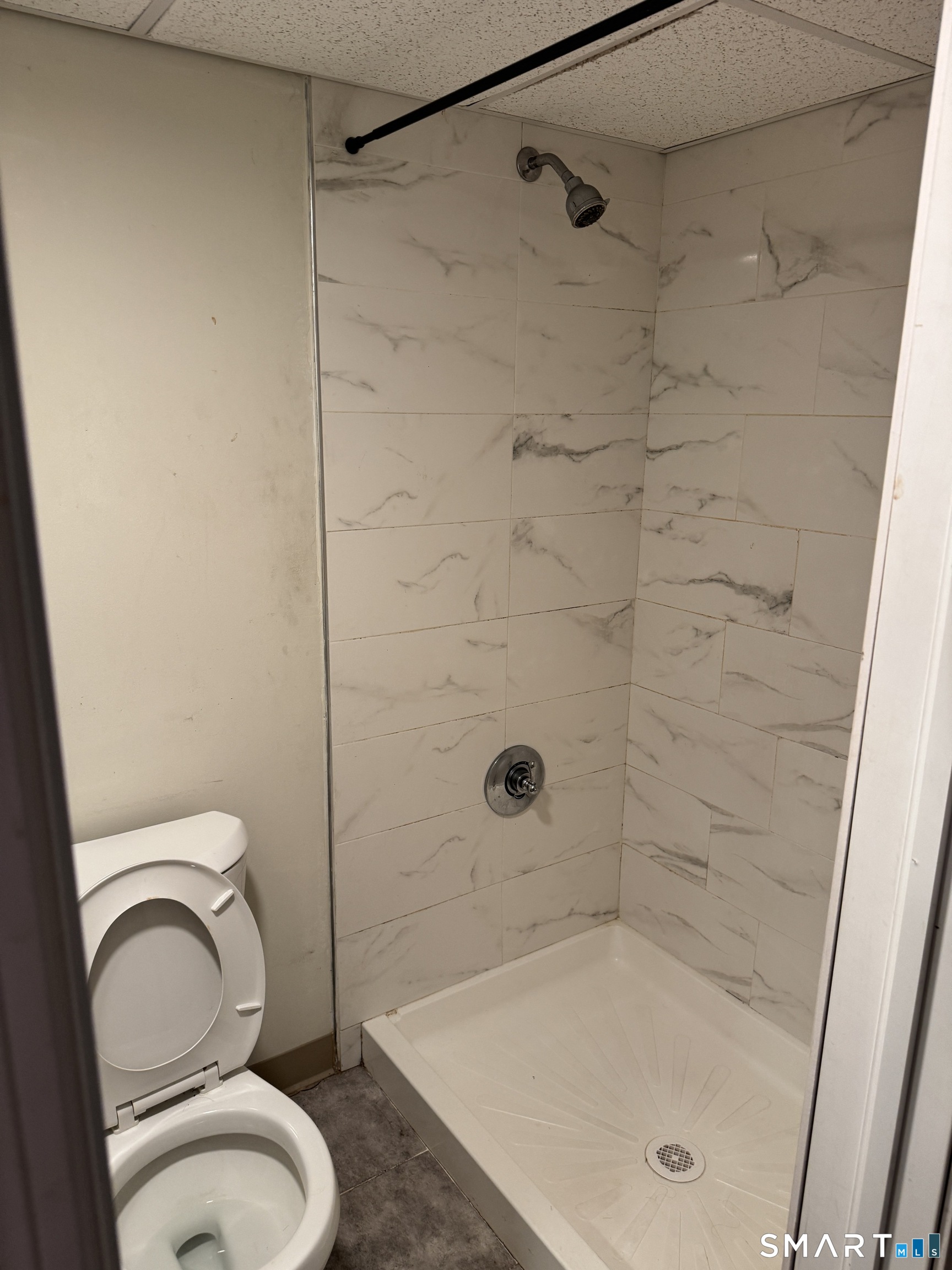 138 Greene Street Bristol, CT 06010 - Photo 26 of 32 a bathroom with a shower a toilet and a sink