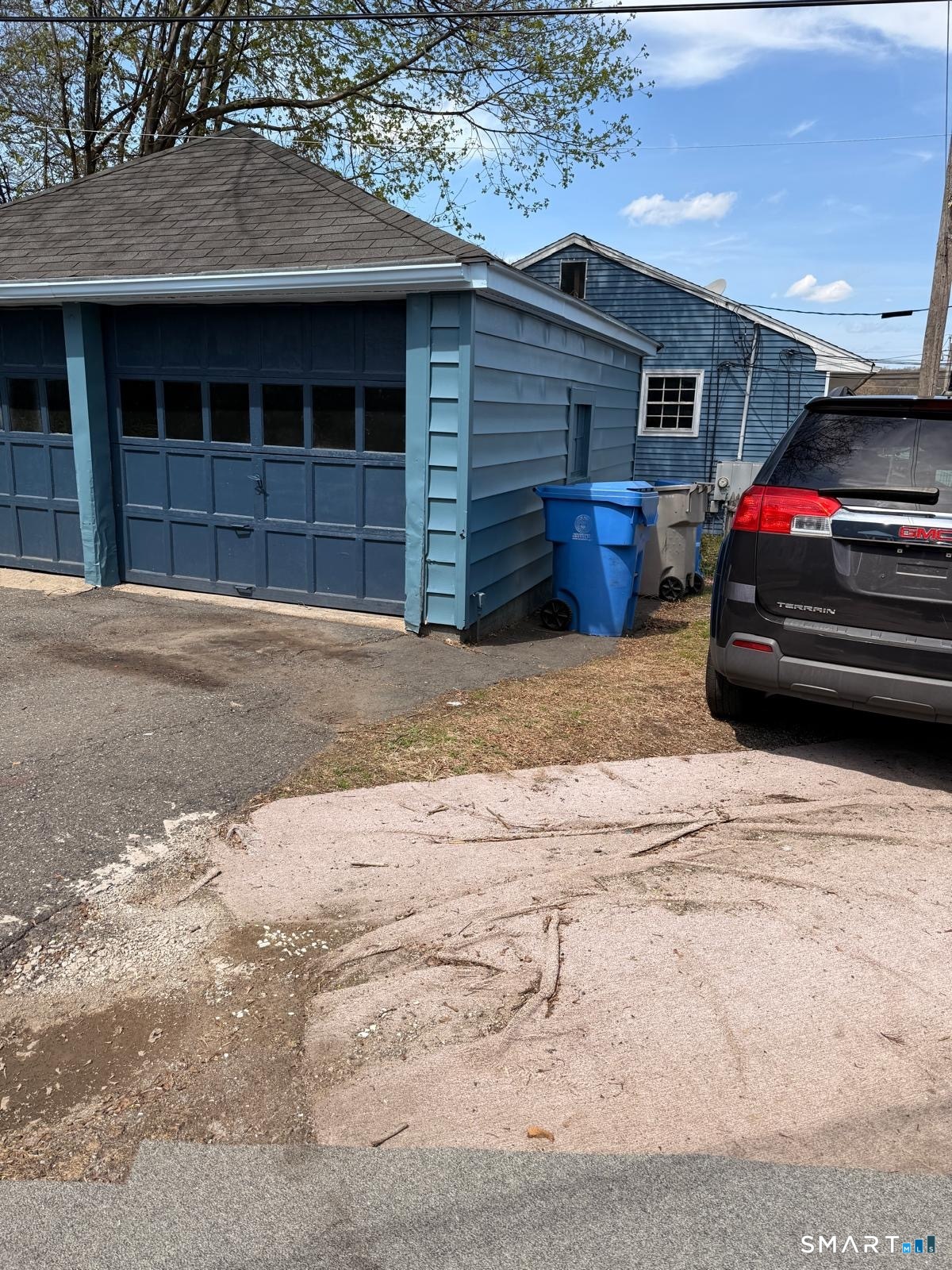 138 Greene Street Bristol, CT 06010 - Photo 5 of 32 a view of parking area and car parked