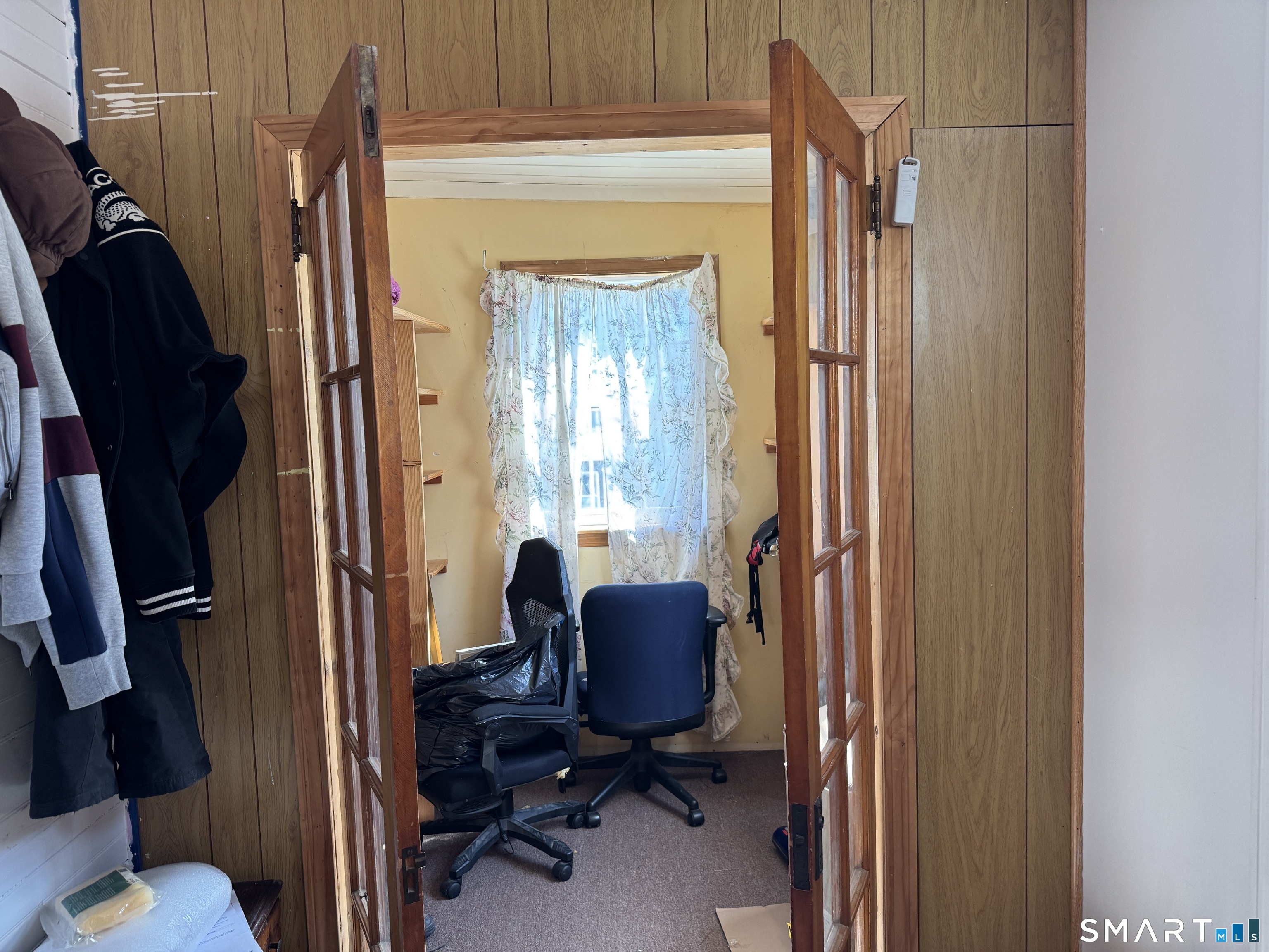 138 Greene Street Bristol, CT 06010 - Photo 6 of 32 a view of a workspace with furniture and a window