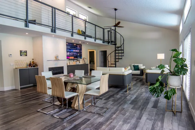 a view of a dining room with furniture window and wooden floor