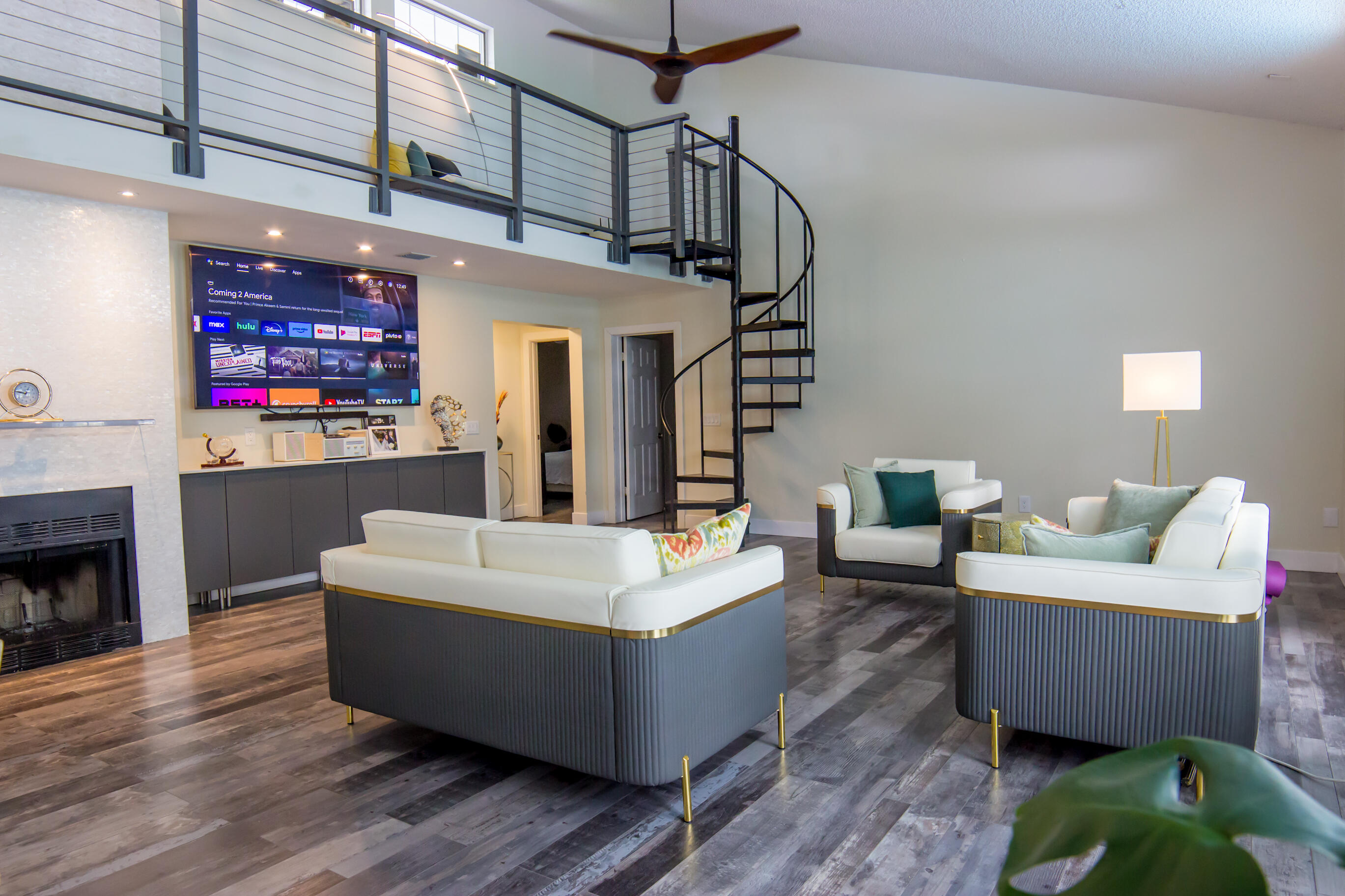 661 West Rambling Drive Wellington, FL 33414 - Photo 16 of 33 a living room with furniture a fireplace and a chandelier