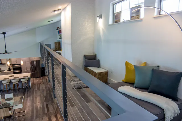 a bed room with furniture and wooden floor