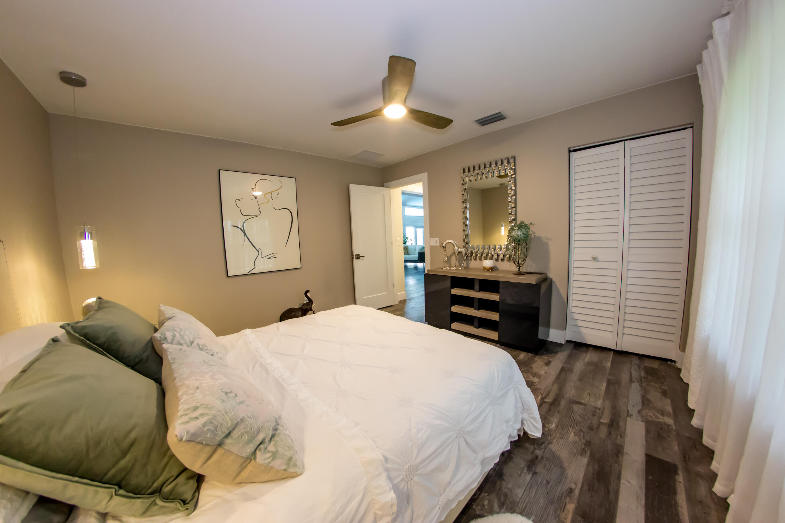 661 West Rambling Drive Wellington, FL 33414 - Photo 20 of 33 a bed room with a bed and a ceiling fan