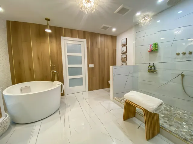 a spacious bathroom with a bathtub and shower