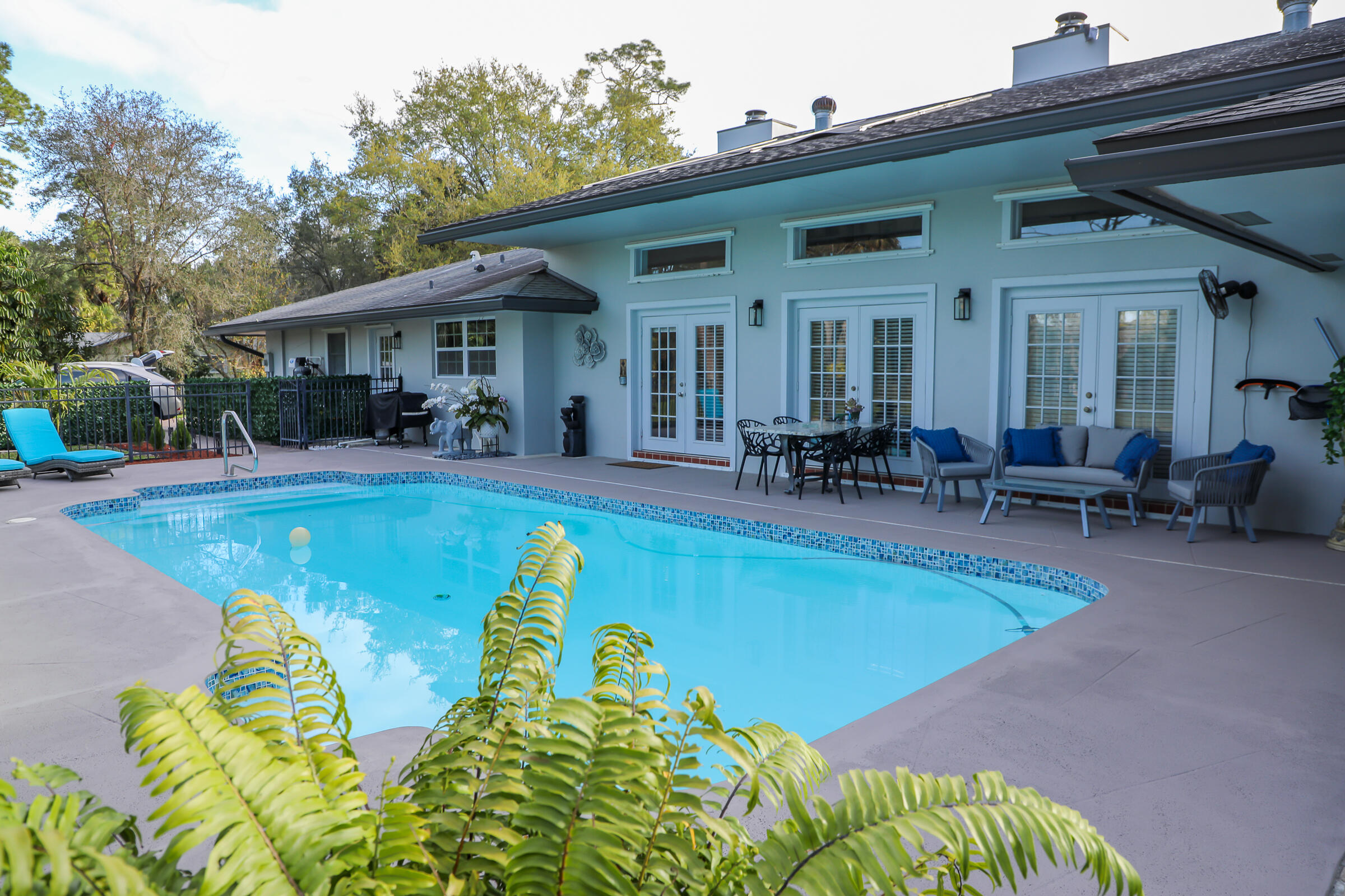 661 West Rambling Drive Wellington, FL 33414 - Photo 8 of 33 a view of a house with swimming pool and sitting area