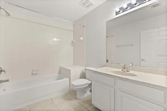 a bathroom with a sink a toilet and a bathtub