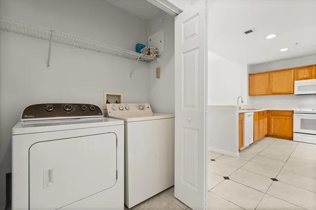 a utility room with dryer and washer