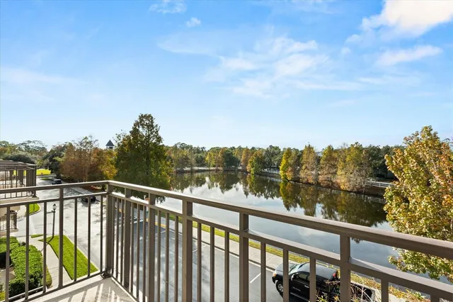 a view of a balcony with lake view and mountain view