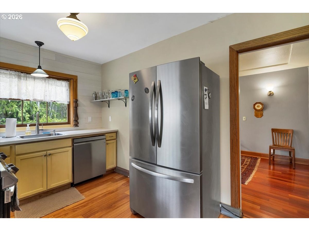 162 Riverside Drive Idanha, OR 97350 - Photo 17 of 37 a kitchen with stainless steel appliances granite countertop a refrigerator a sink and a stove