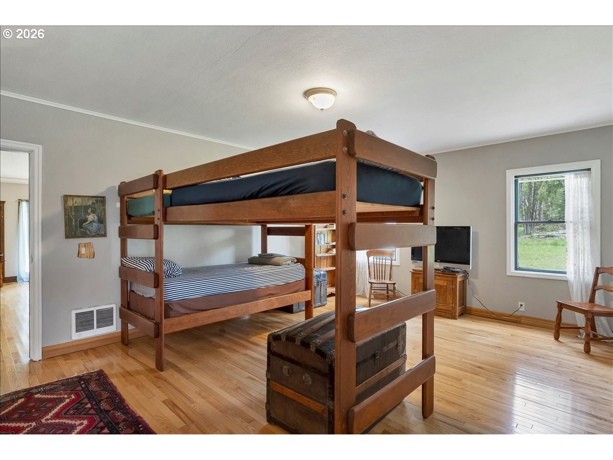 162 Riverside Drive Idanha, OR 97350 - Photo 19 of 37 a bedroom with furniture and a wooden floor