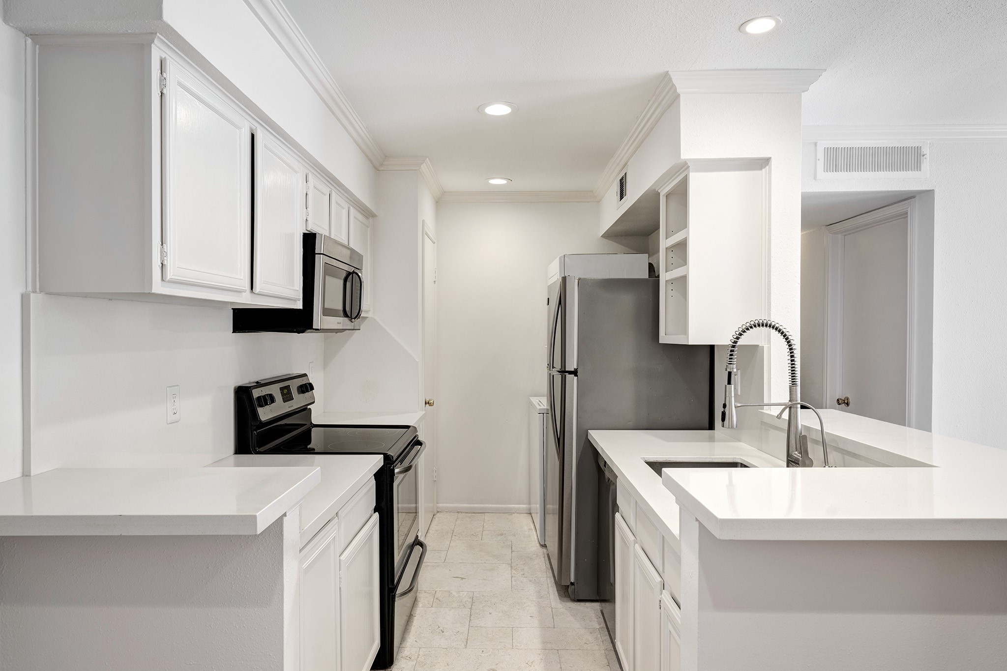 1601 South Shepherd Drive, Unit 224 Houston, TX 77019 - Photo 6 of 14 a kitchen with stainless steel appliances granite countertop a sink stove and refrigerator