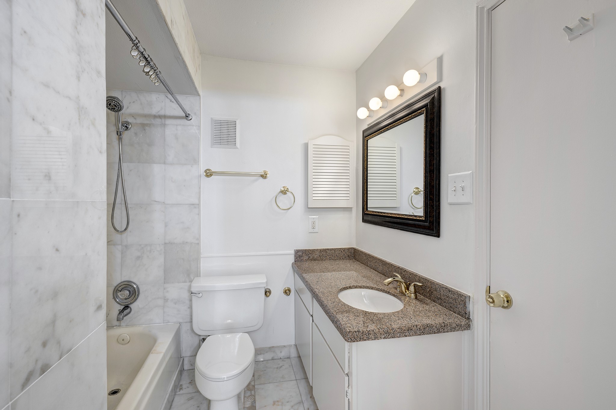 1601 South Shepherd Drive, Unit 224 Houston, TX 77019 - Photo 9 of 14 a bathroom with a granite countertop sink toilet and shower