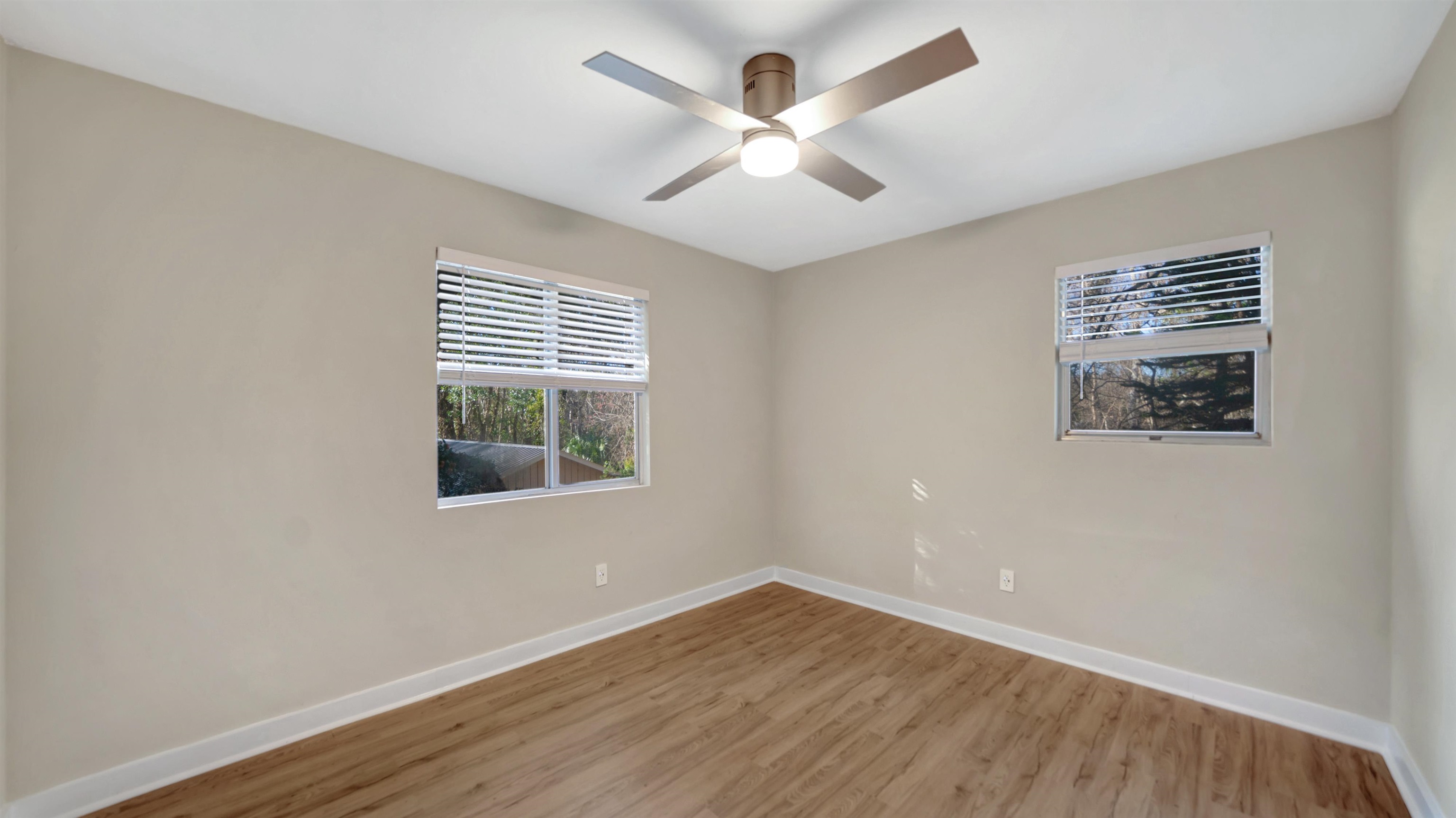 114 Cardinal Road St. Augustine, FL 32086 - Photo 15 of 30 a view of an empty room with wooden floor and a window