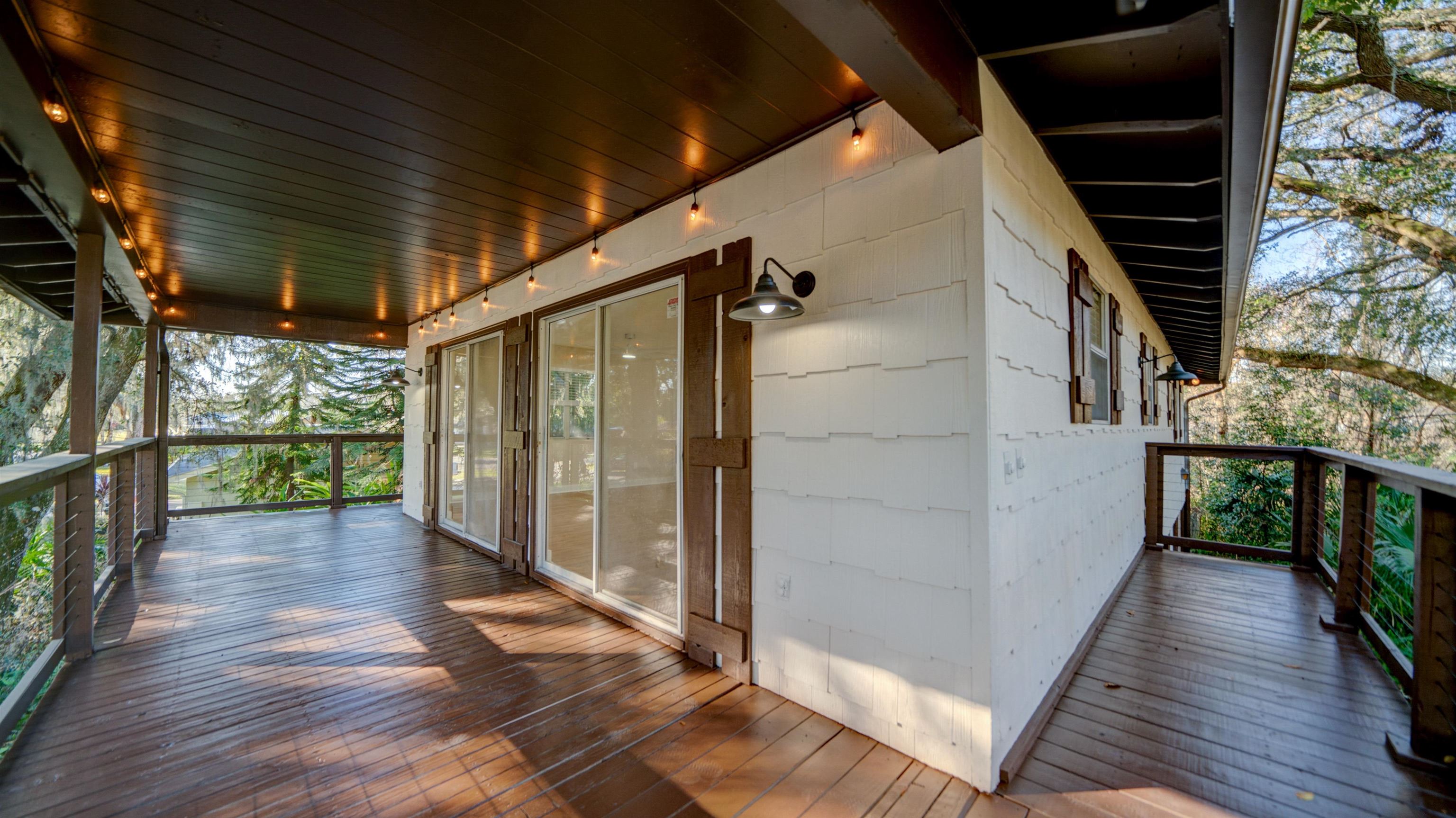 114 Cardinal Road St. Augustine, FL 32086 - Photo 20 of 30 a view of a porch with wooden floor and stairs