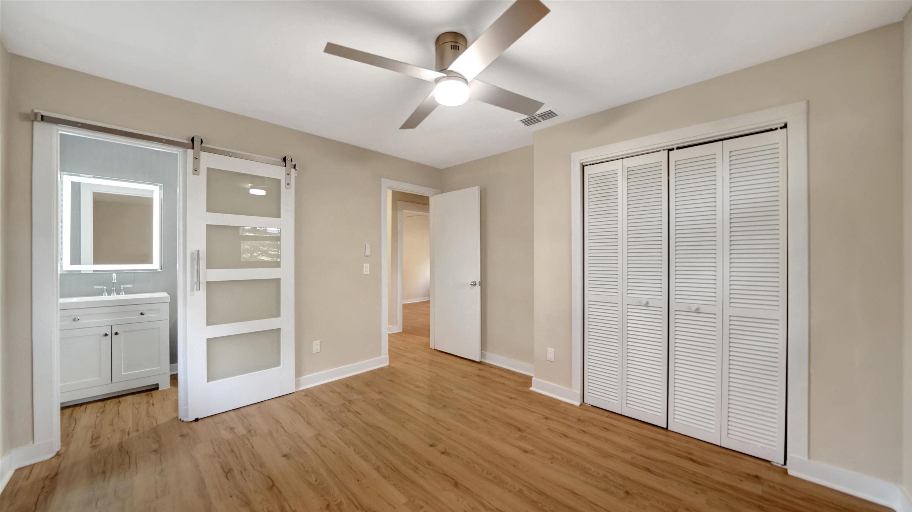 114 Cardinal Road St. Augustine, FL 32086 - Photo 7 of 30 wooden floor in an empty room with a window