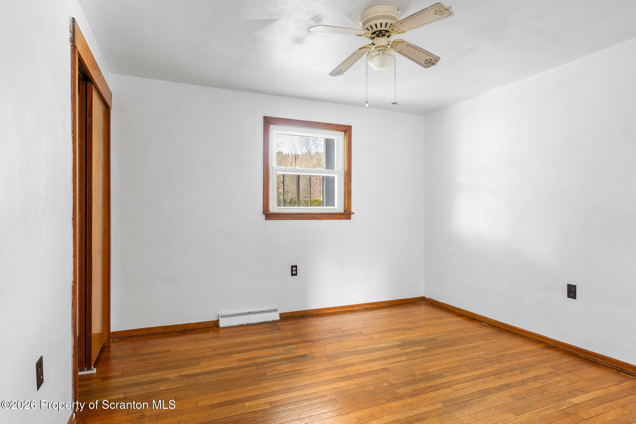 139 N Road Windsor, NY 13865 - Photo 18 of 44 a view of empty room with wooden floor and fan