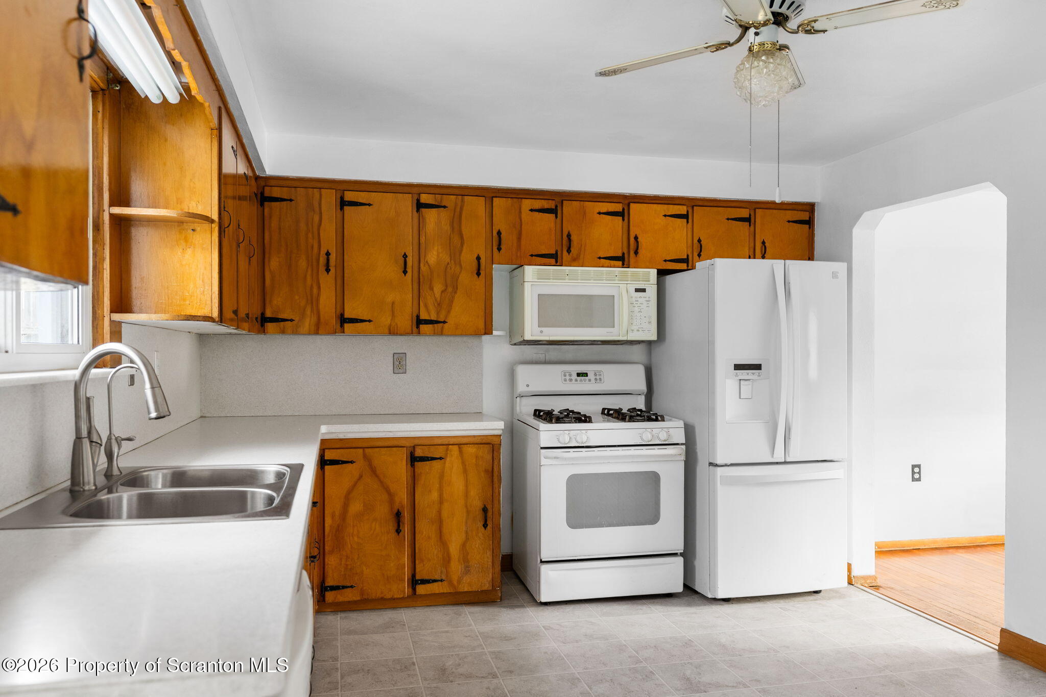 139 N Road Windsor, NY 13865 - Photo 19 of 44 a kitchen with stainless steel appliances a stove a sink and a refrigerator