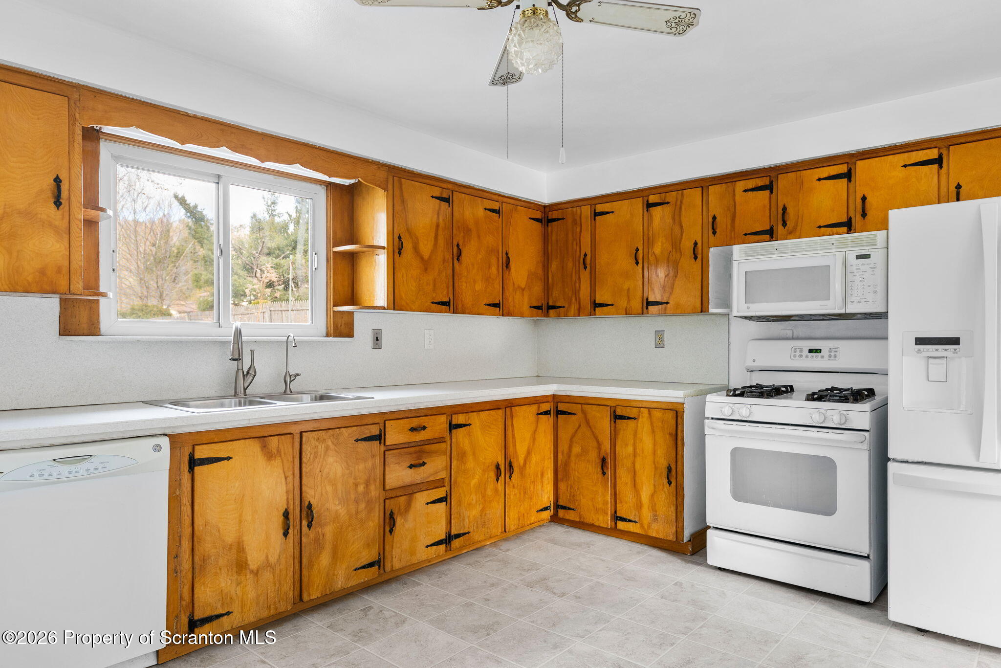 139 N Road Windsor, NY 13865 - Photo 23 of 44 a kitchen with stainless steel appliances a stove a sink and a refrigerator