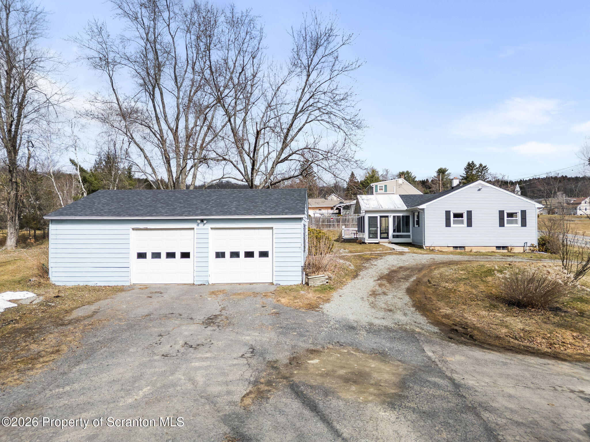 139 N Road Windsor, NY 13865 - Photo 34 of 44 a view of a white house with a yard covered in snow