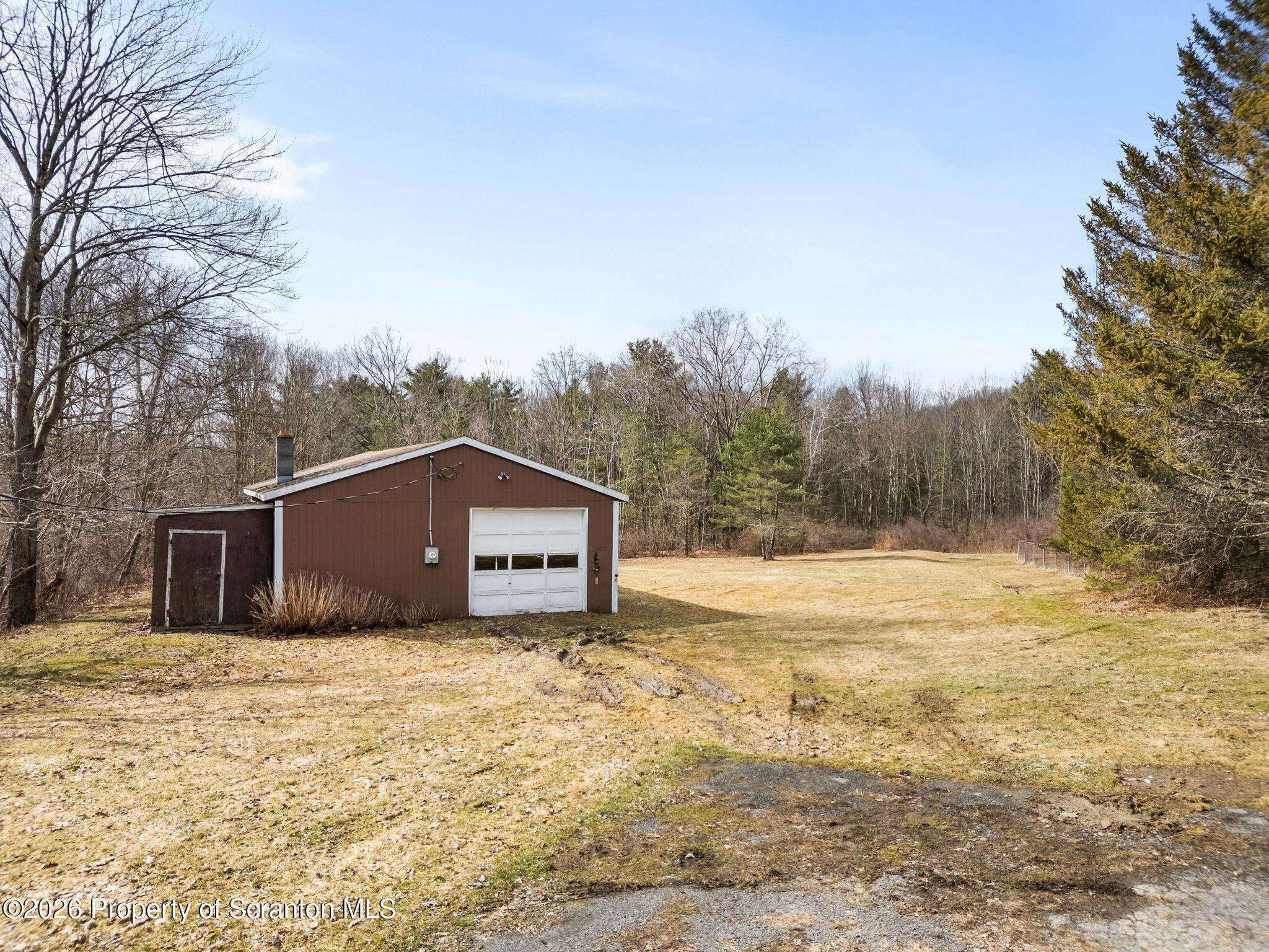 139 N Road Windsor, NY 13865 - Photo 36 of 44 a house with trees in the background