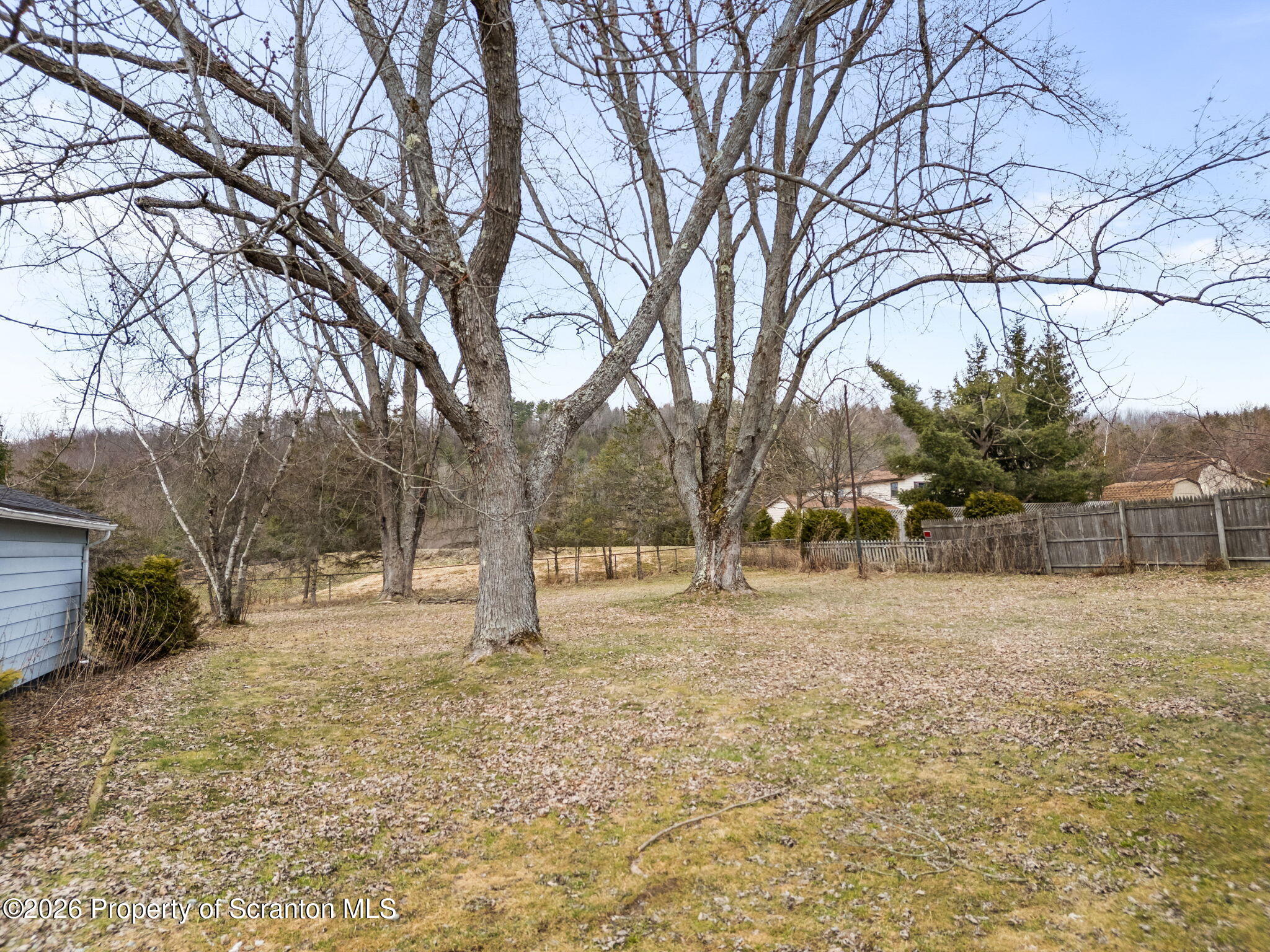 139 N Road Windsor, NY 13865 - Photo 40 of 44 a backyard of a house with trees