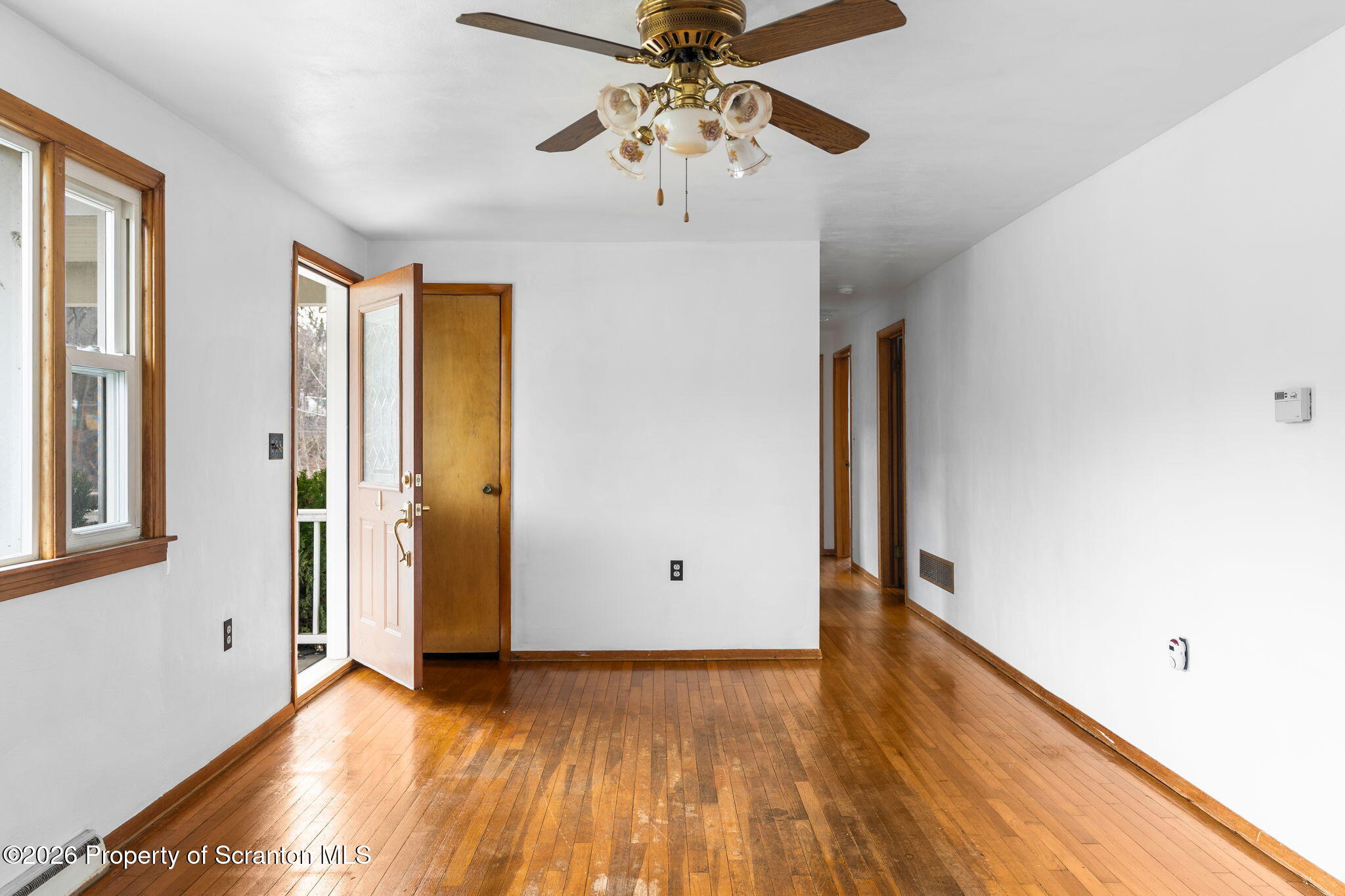 139 N Road Windsor, NY 13865 - Photo 4 of 44 a view of an empty room with window and wooden floor