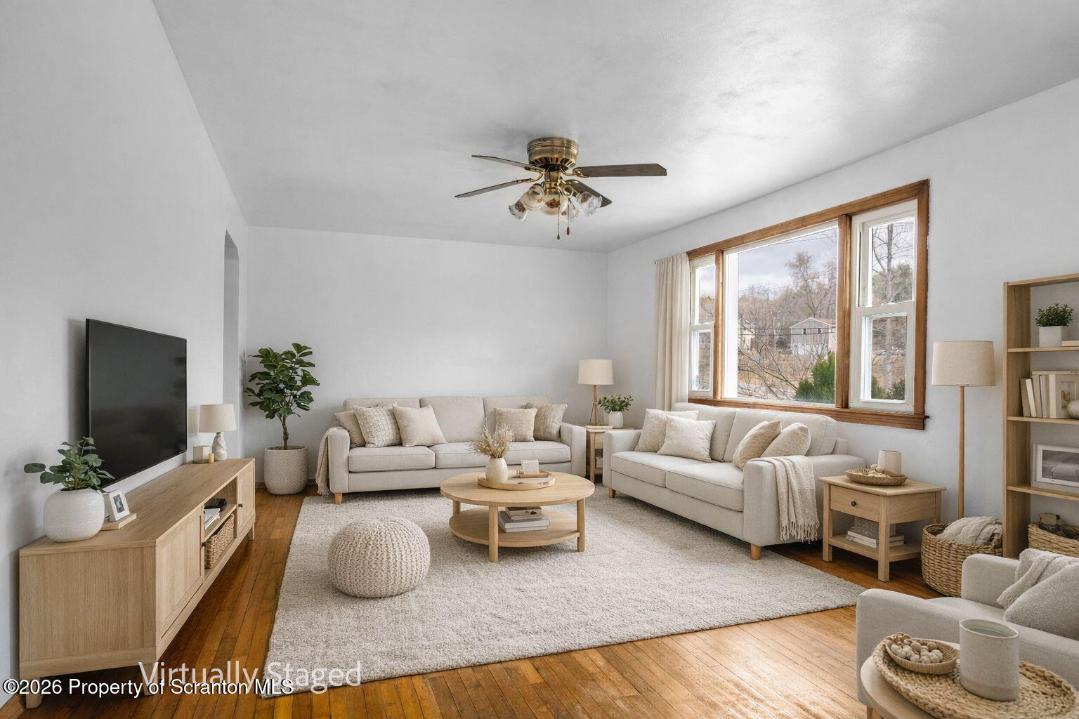 139 N Road Windsor, NY 13865 - Photo 7 of 44 a living room with furniture a flat screen tv and a large window