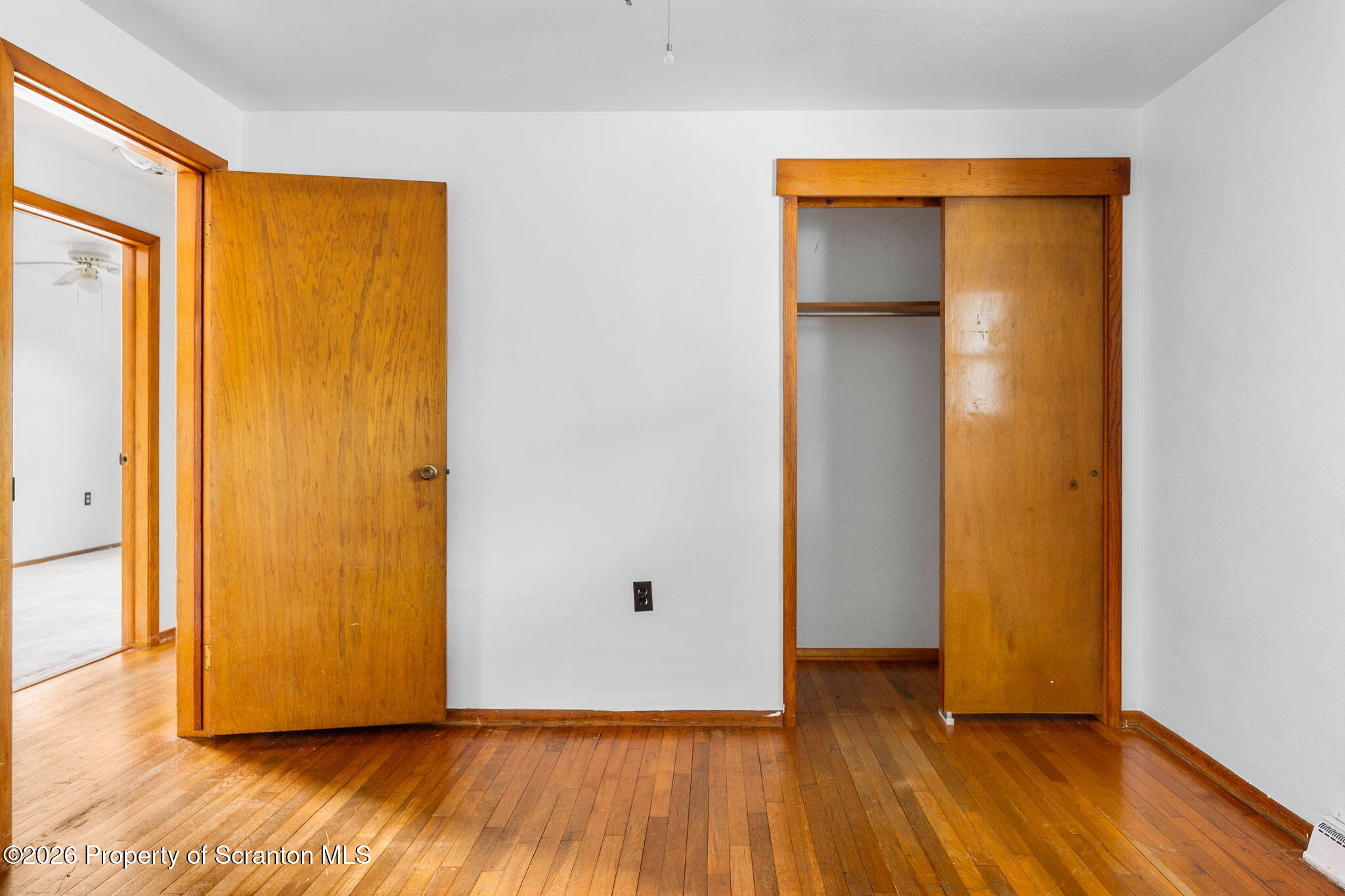 139 N Road Windsor, NY 13865 - Photo 9 of 44 a view of an empty room with wooden floor and a window