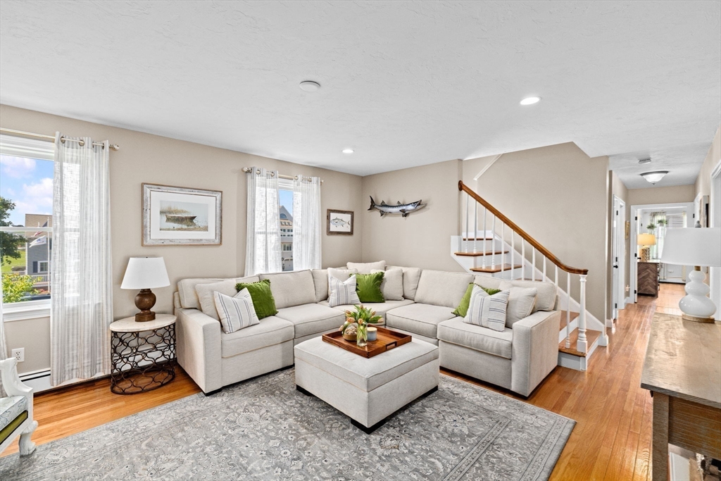 5 Cliff Estates Road Scituate, MA 02066 - Photo 12 of 42 a living room with furniture and a wooden floor