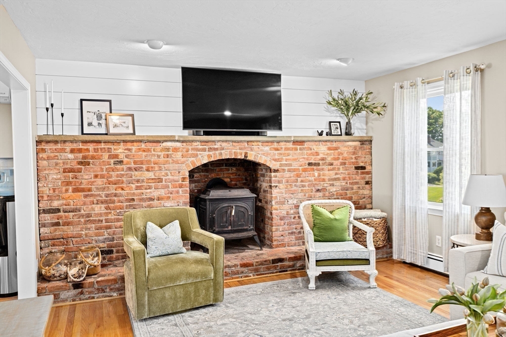 5 Cliff Estates Road Scituate, MA 02066 - Photo 13 of 42 a living room with furniture and a flat screen tv