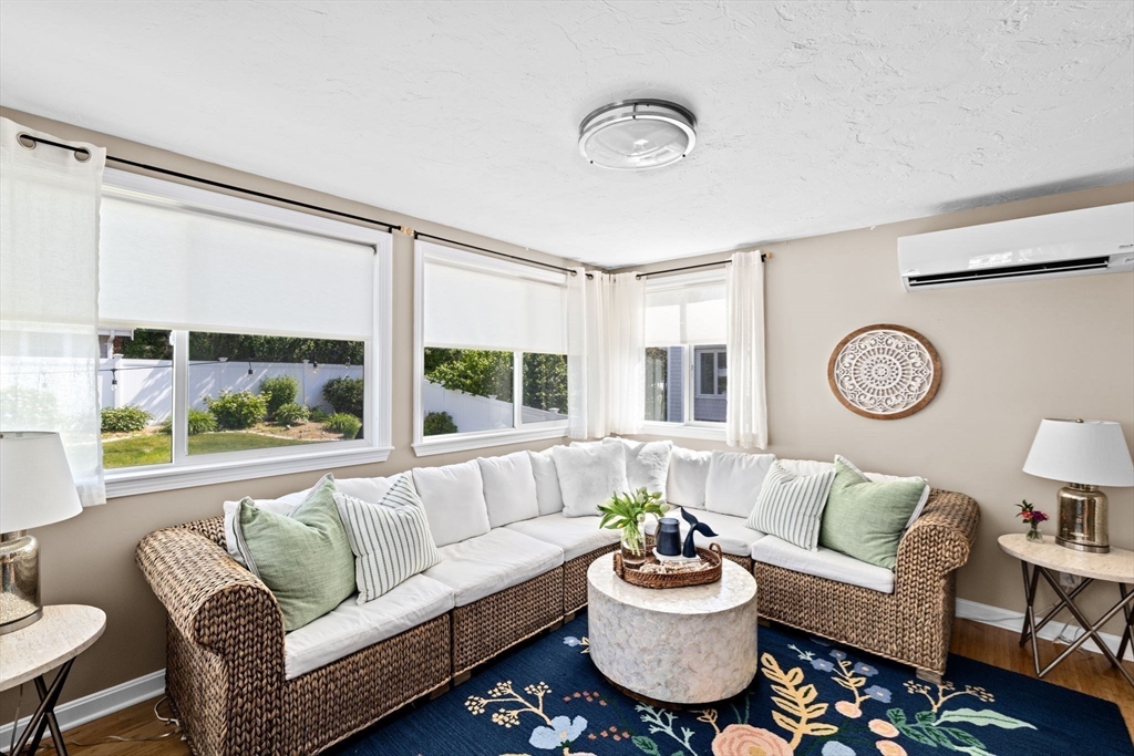 5 Cliff Estates Road Scituate, MA 02066 - Photo 15 of 42 a living room with furniture and a large window