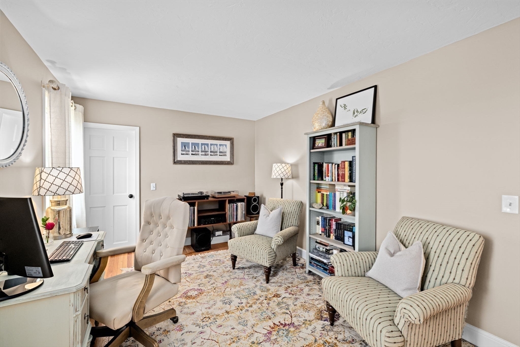 5 Cliff Estates Road Scituate, MA 02066 - Photo 18 of 42 a living room with furniture a fireplace and a flat screen tv