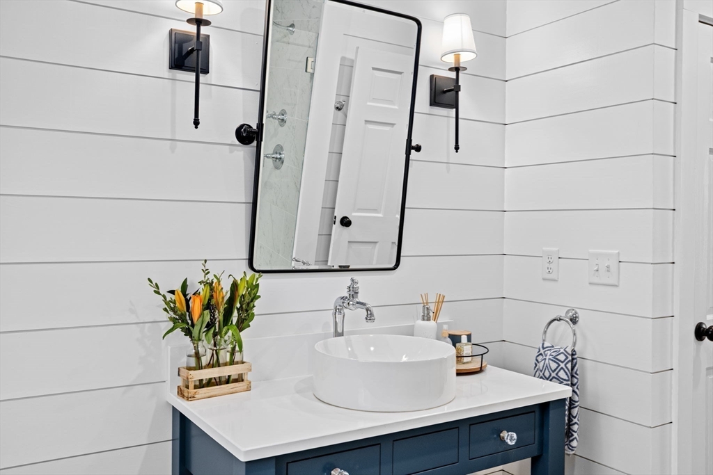 5 Cliff Estates Road Scituate, MA 02066 - Photo 20 of 42 a bathroom with a sink and a mirror