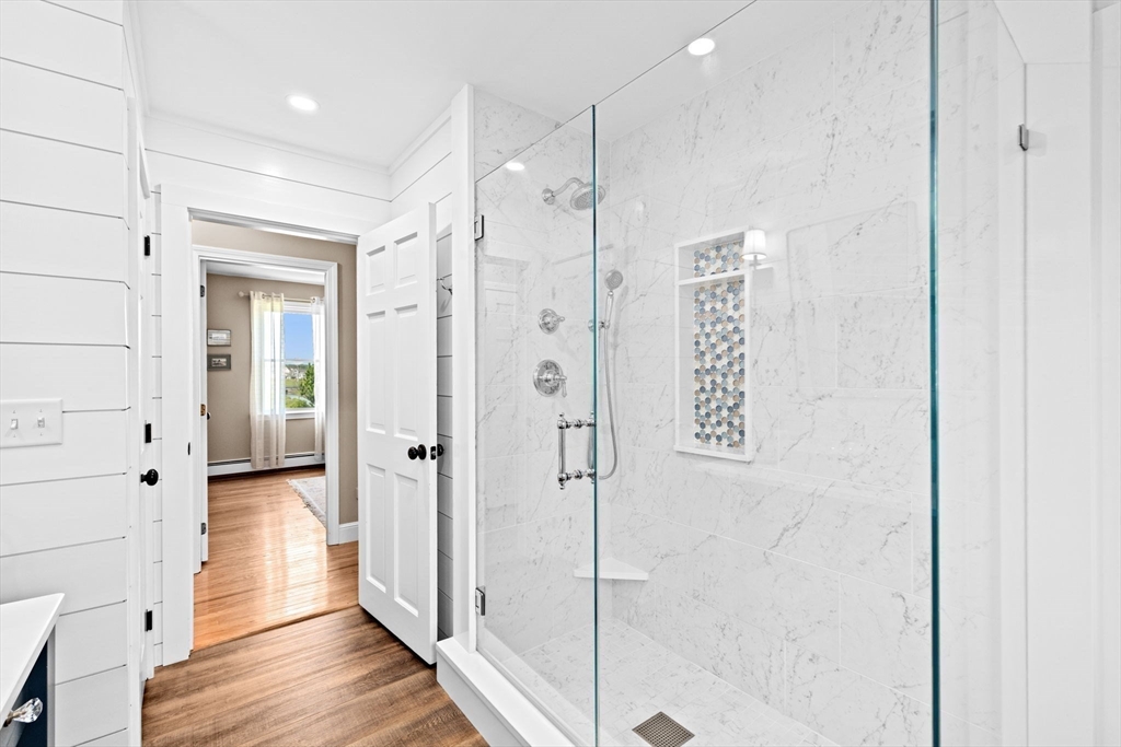 5 Cliff Estates Road Scituate, MA 02066 - Photo 21 of 42 a bathroom with a shower and a glass door