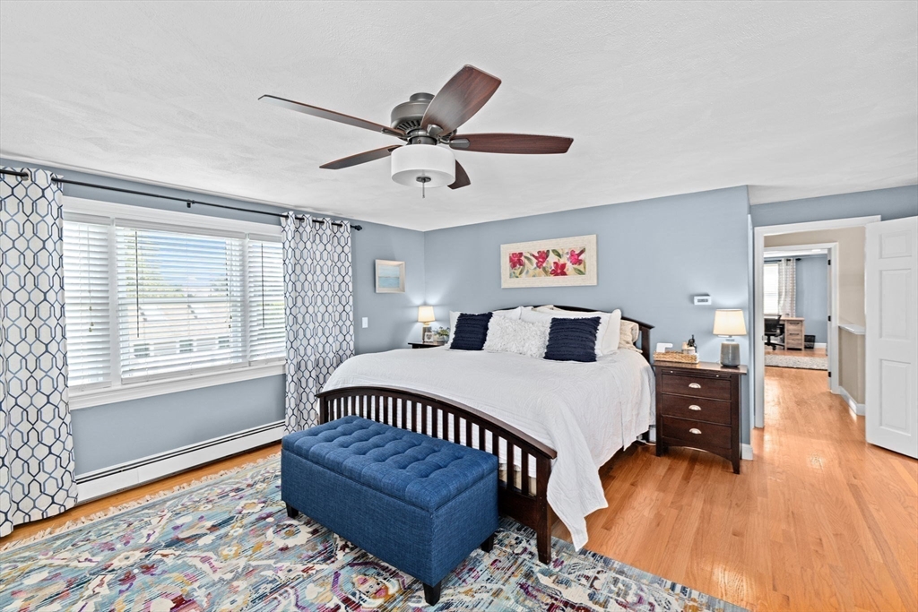 5 Cliff Estates Road Scituate, MA 02066 - Photo 22 of 42 a bedroom with a bed and wooden floor
