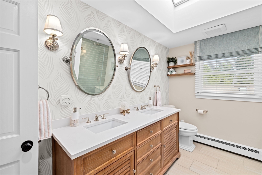 5 Cliff Estates Road Scituate, MA 02066 - Photo 24 of 42 a bathroom with a sink and a mirror