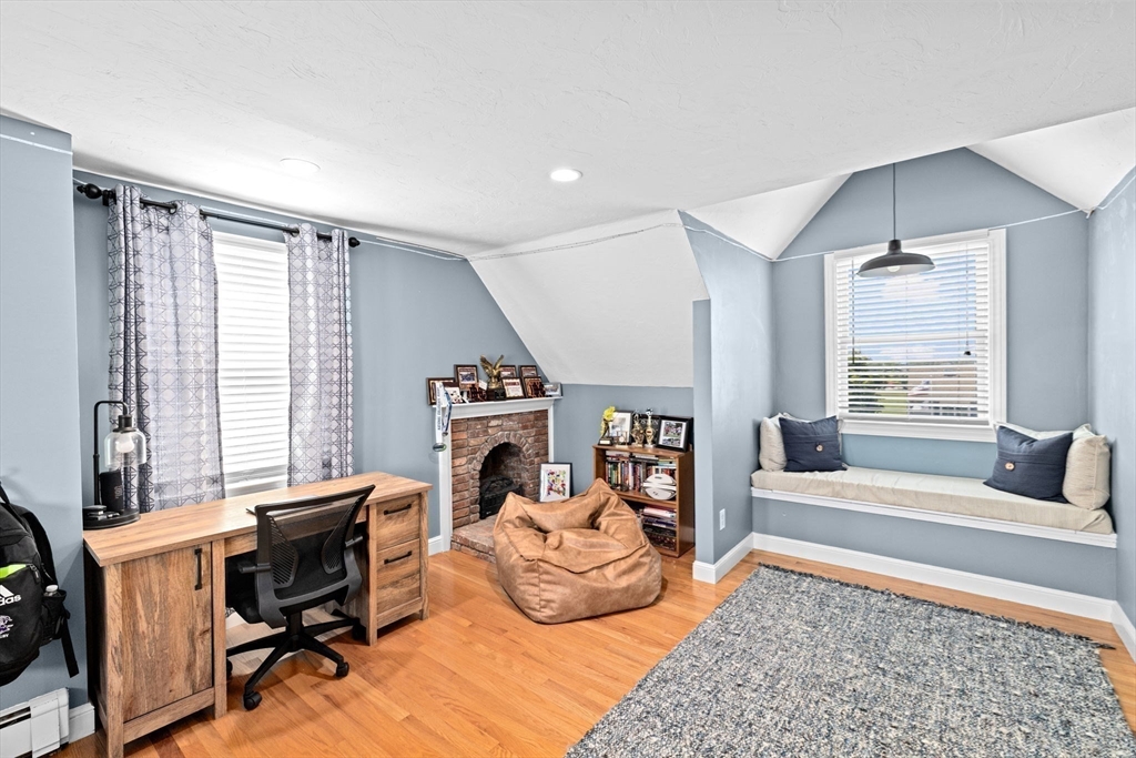 5 Cliff Estates Road Scituate, MA 02066 - Photo 28 of 42 a living room with furniture and a fireplace