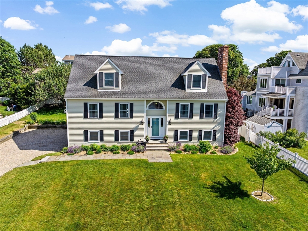 5 Cliff Estates Road Scituate, MA 02066 - Photo 3 of 42 a front view of a house with garden and houses
