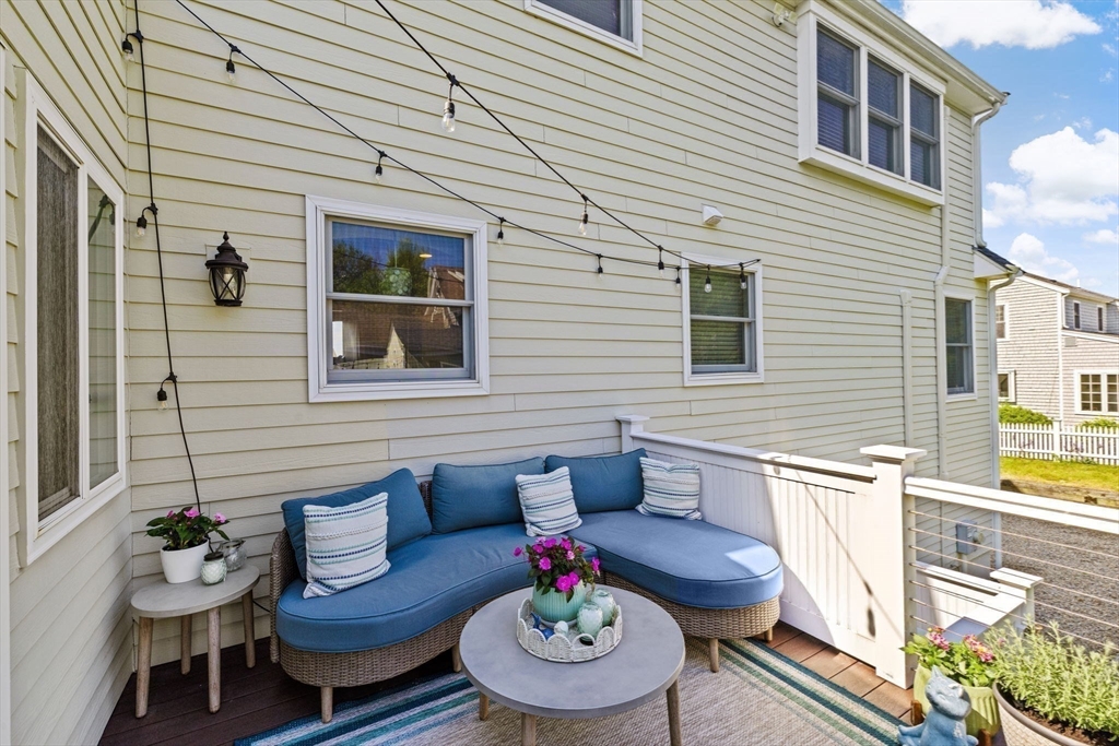 5 Cliff Estates Road Scituate, MA 02066 - Photo 36 of 42 a view of a patio with couches table and chairs and potted plants