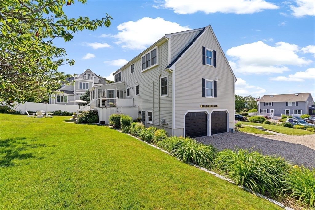 5 Cliff Estates Road Scituate, MA 02066 - Photo 41 of 42 a front view of a house with garden and porch