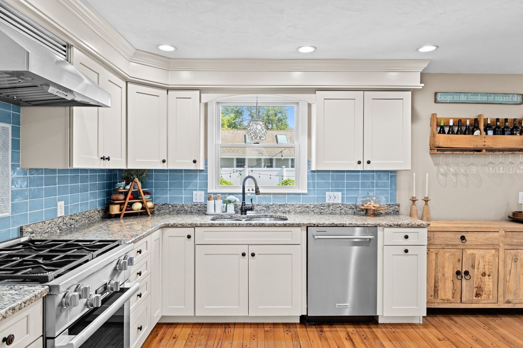5 Cliff Estates Road Scituate, MA 02066 - Photo 6 of 42 a kitchen with cabinets appliances a sink and a counter top space