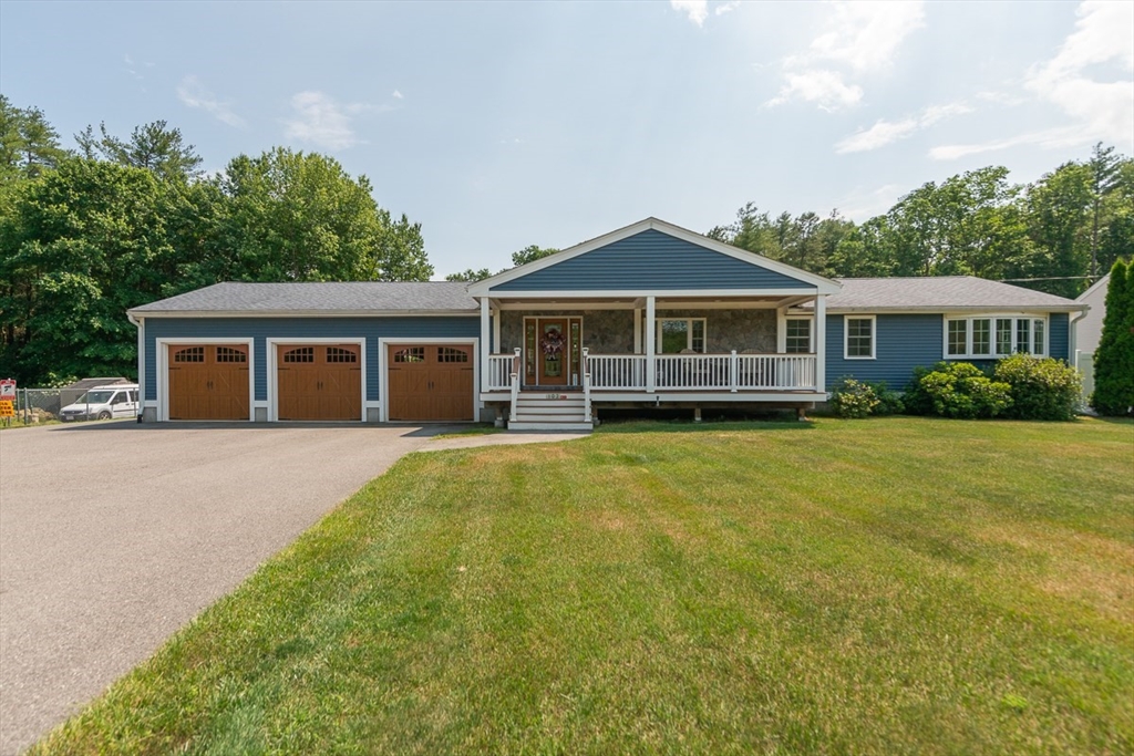 103 Lowell Road Pepperell, MA 01463 - Photo 1 of 42 a front view of a house with a garden