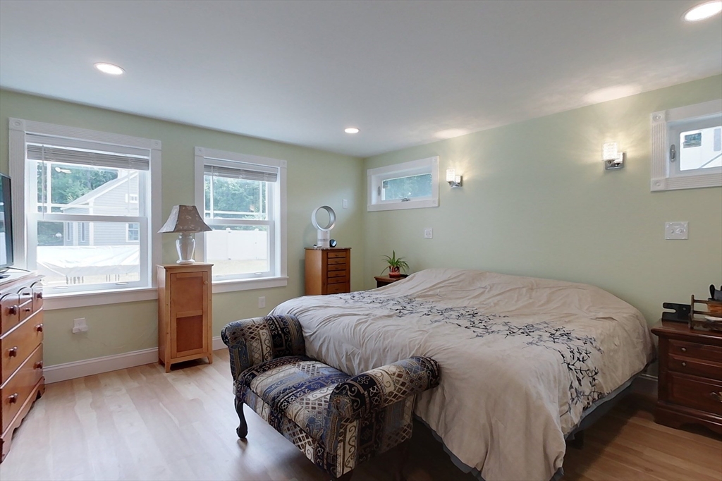 103 Lowell Road Pepperell, MA 01463 - Photo 13 of 42 a bedroom with a bed and a window