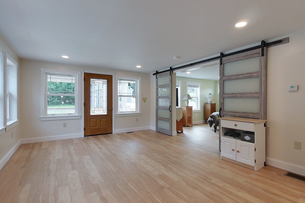 103 Lowell Road Pepperell, MA 01463 - Photo 17 of 42 a view of livingroom with furniture wooden floor and window