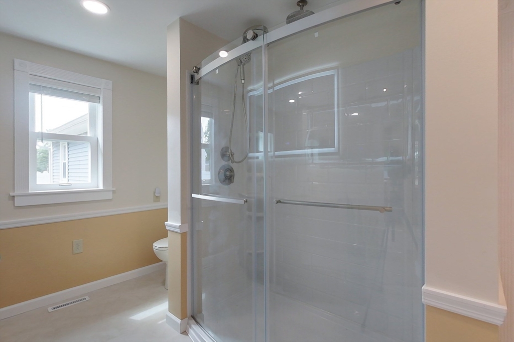 103 Lowell Road Pepperell, MA 01463 - Photo 21 of 42 a bathroom with a shower and a toilet