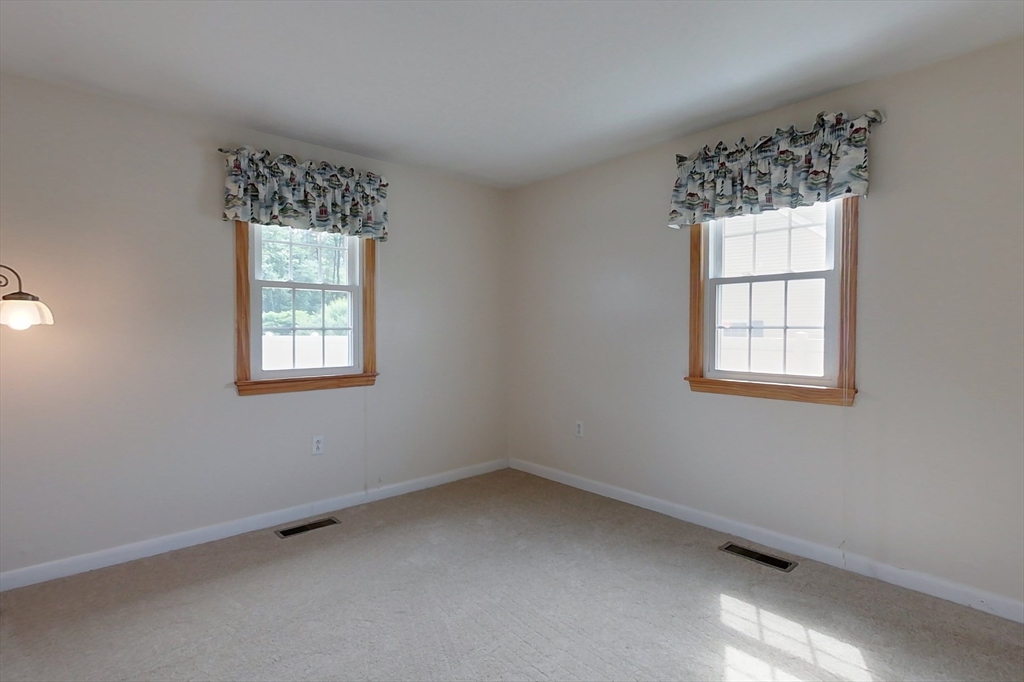 103 Lowell Road Pepperell, MA 01463 - Photo 23 of 42 an empty room with a window