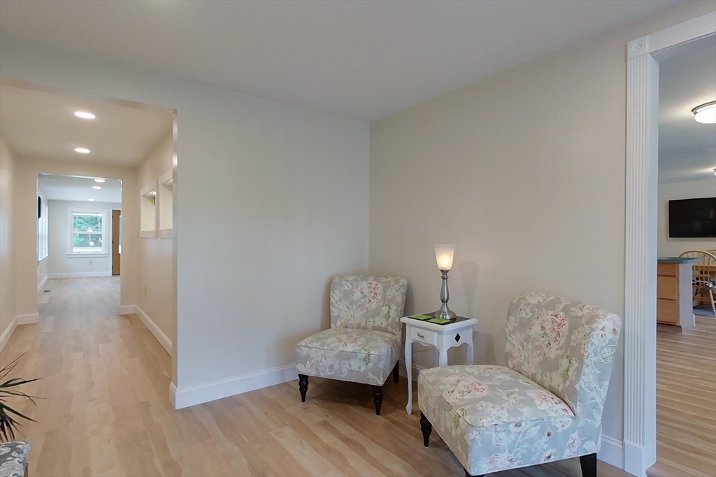 103 Lowell Road Pepperell, MA 01463 - Photo 29 of 42 a living room with furniture and a couch