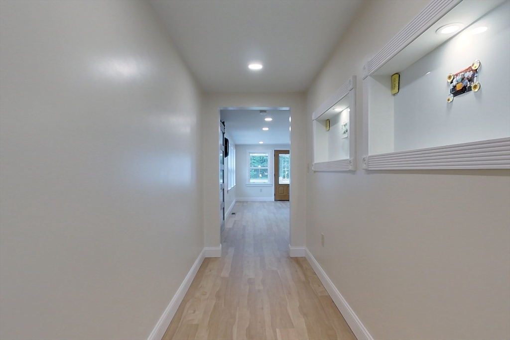 103 Lowell Road Pepperell, MA 01463 - Photo 30 of 42 a view of hallway with wooden floor
