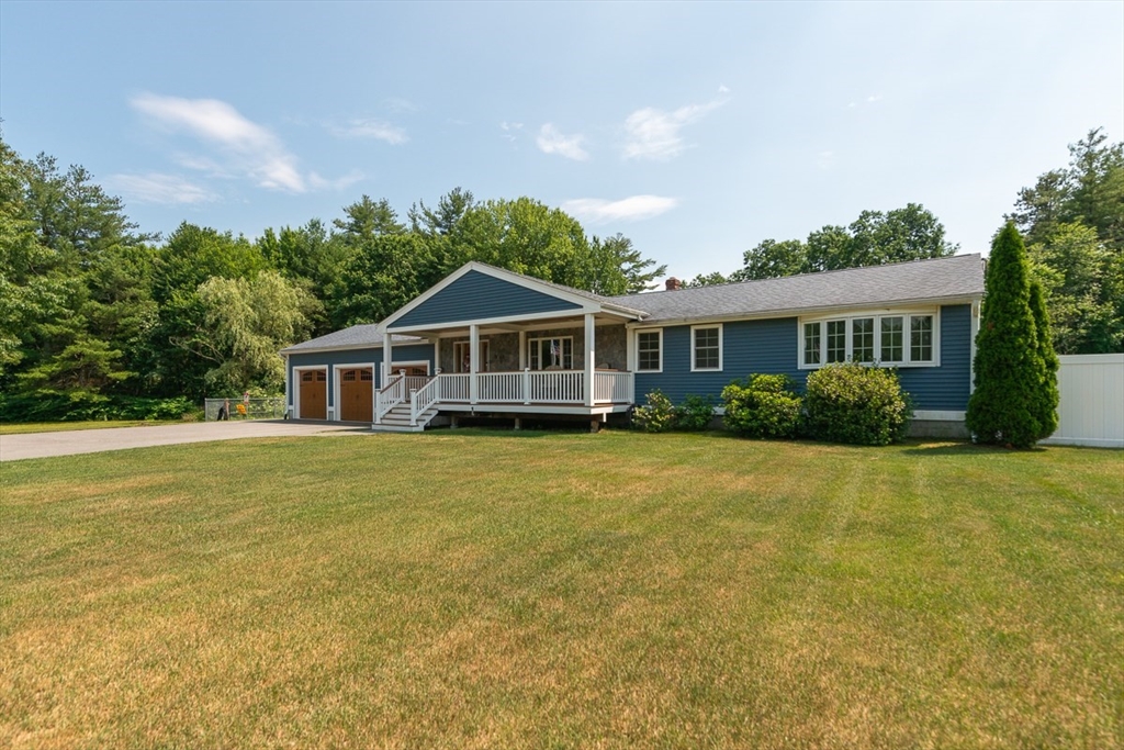 103 Lowell Road Pepperell, MA 01463 - Photo 40 of 42 a front view of a house with a garden