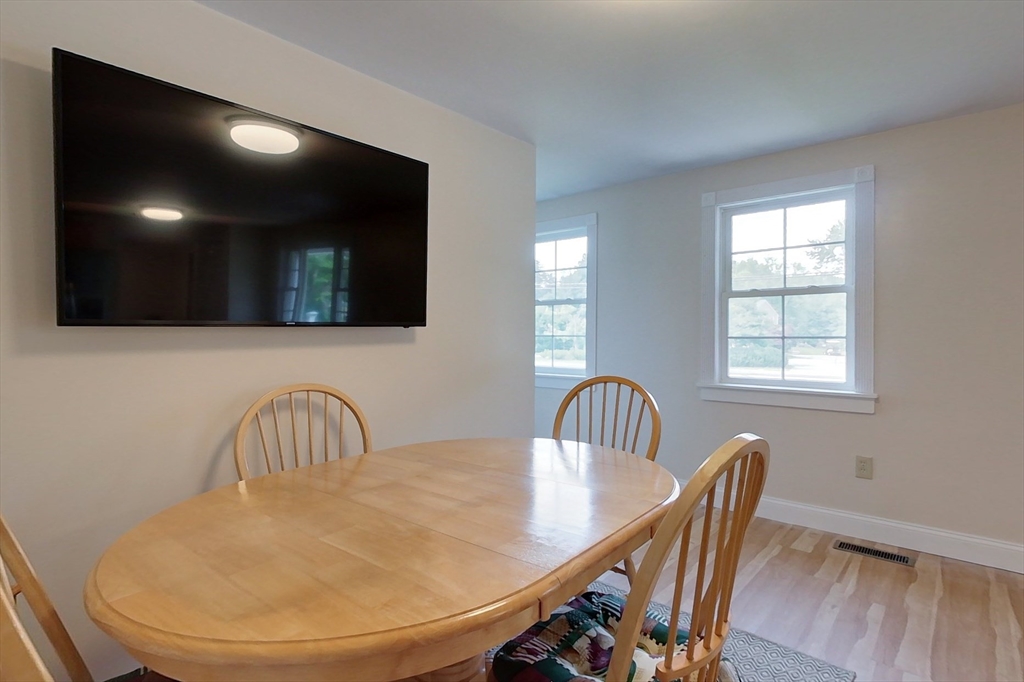 103 Lowell Road Pepperell, MA 01463 - Photo 8 of 42 a view of a dining room with furniture
